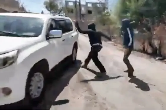 Palestinian woman and NBC News team attacked by masked Israeli settlers in West Bank
