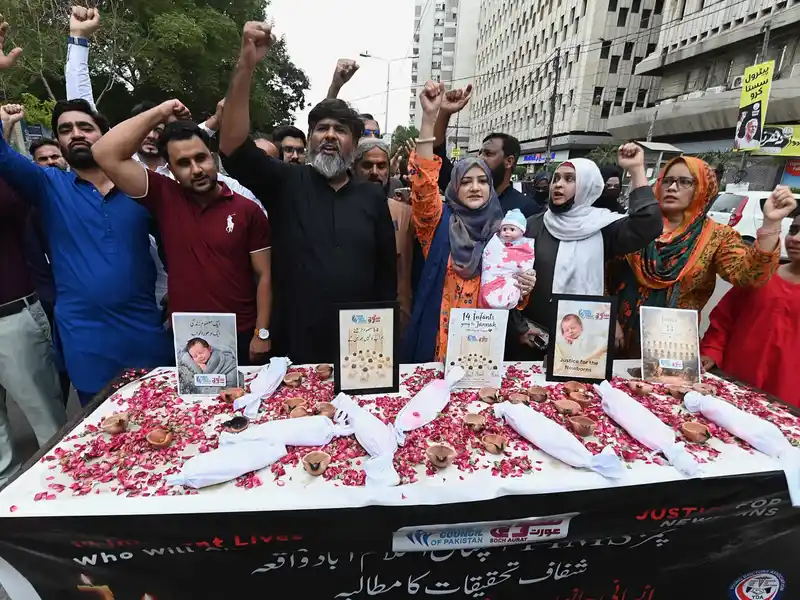 Pakistan suspends eight officials over hospital fire that killed 14 babies