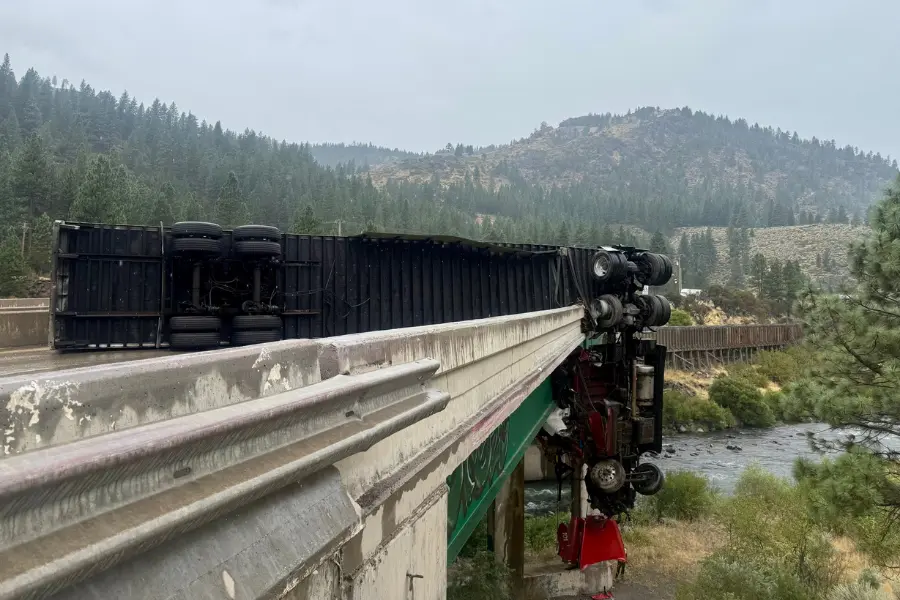 Big rig left dangling over California bridge after crashing through railing