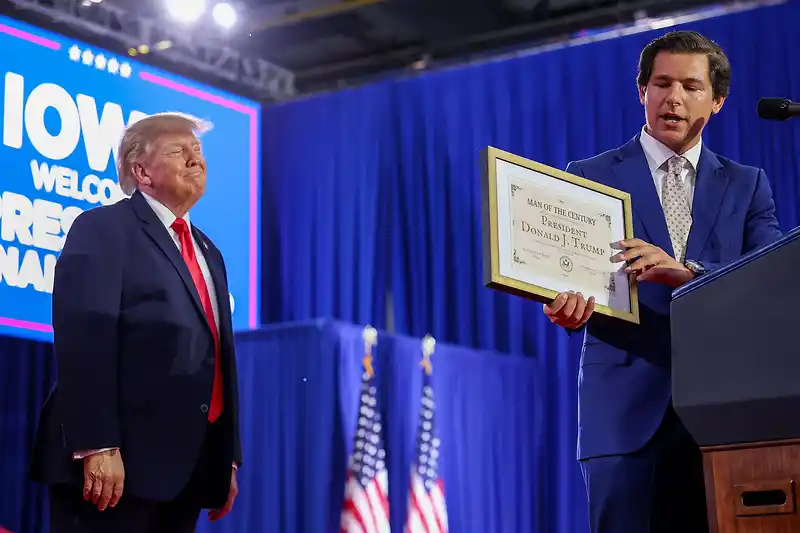 Trump presented with made-up ‘Man of the Century Award’ at Iowa rally