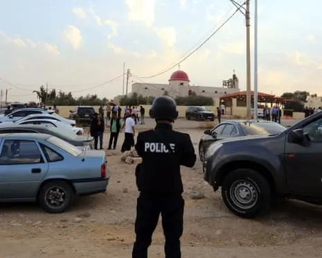 Eight killed and 40 injured after gunmen open fire at church funeral in Jordan
