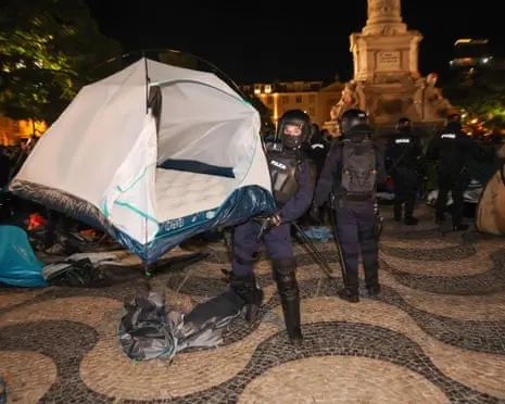 Portuguese police with dogs and batons dismantle housing protest camps