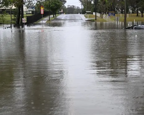 Man found dead in Queensland flood waters as state hit by multiple storms and days-long deluge