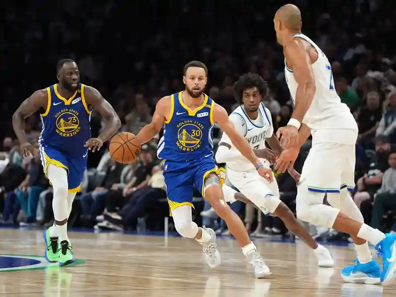 Stephen Curry, Warriors hold nerve to beat Timberwolves in tight NBA battle