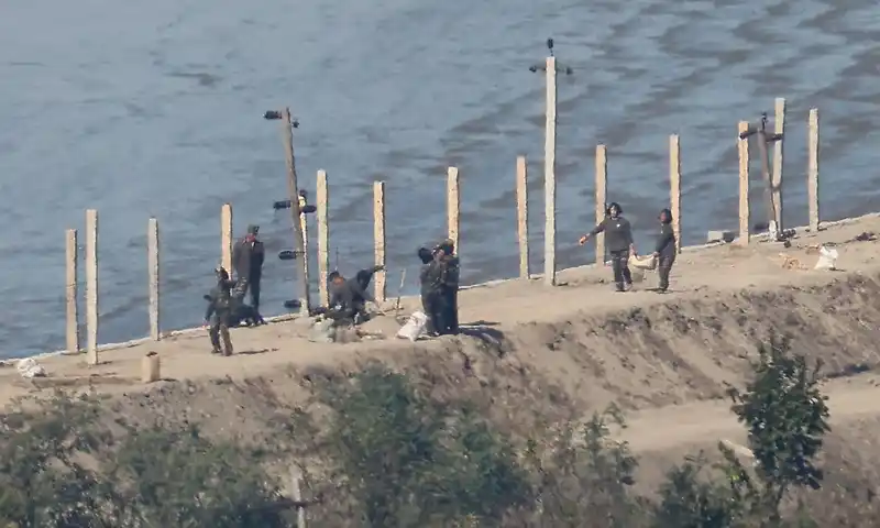 North Korea fires missiles as row over landmine blast intensifies