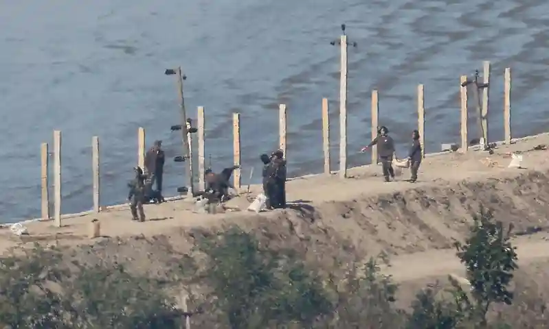 North Korea fires missiles as row over landmine blast intensifies
